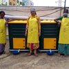 pair of Daily Dump Gaia OWC bulk composters outside apartment building for composting kitchen waste 