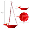 Yellow Bird feeder hanging 3 D against corrugated background
