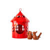 Red hanging metal birdhouse with chain with sparrow in outdoor garden