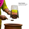 Bamboo Sieve, Microbes Powder, Neem Powder and gloves on corrugated background