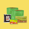 Two Green grow bags with Cocobrick and Seed Balls packet and Compost against corrugated background
