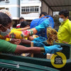 pair of Daily Dump Gaia OWC bulk composters outside apartment building for composting kitchen waste 