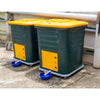 pair of Daily Dump Gaia OWC bulk composters outside apartment building for composting kitchen waste 