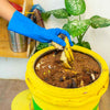 Daily Dump latex free teal gloves in use while handling kitchen waste in Khamba Composter