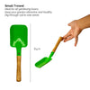 Yellow pot with plate trowel Beej Ball and Compost pack on corrugated background