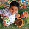 Magic Gamla Pot children's book by Daily Dump about the joy of composting at home on corrugated background