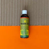 Daily Dump Neem Oil 100ml bottle in foreground and corrugated background