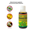 Daily Dump Neem Oil 100ml bottle in foreground and corrugated background