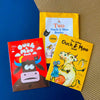 Cover and one Yellow and Red Ouch and Moo children's Books by Daily Dump on corrugated background