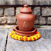 Daily Dump Pooja Ganesha terracotta flower waste home composter kept with other accessories for prayers and offering