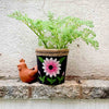 upcycled rubber garden pot 5.5 inch on outdoor stone ledge with fern 