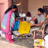Daily Dump Sorting Station in use by man putting in empty glass bottles